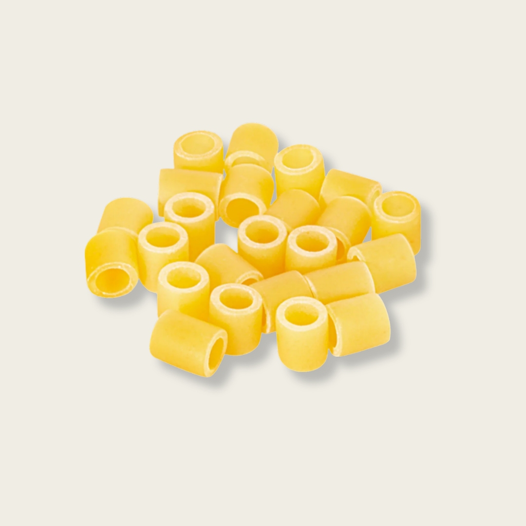 Yellow pasta on a light gray background