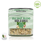 Sea salt blend with basil and garlic in a glass container on a white background