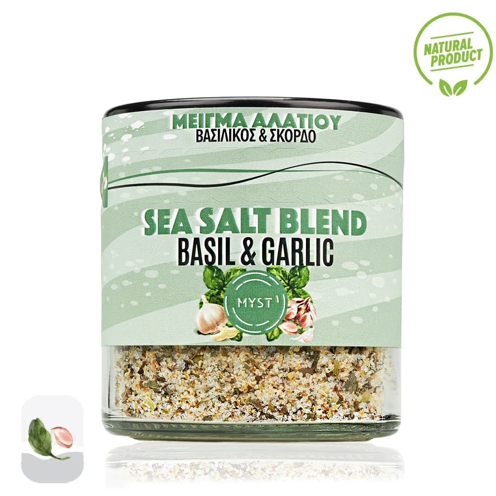 Sea salt blend with basil and garlic in a glass container on a white background