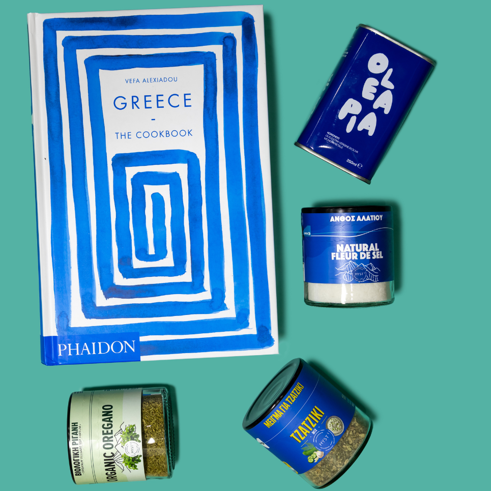 Collection of Greek-themed products including a cookbook and various containers on a teal background