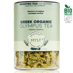 Glass container of Greek organic Olympus tea with visible herbs and branding on a white background