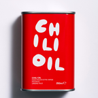 Red can of chili oil with white text on a light gray background