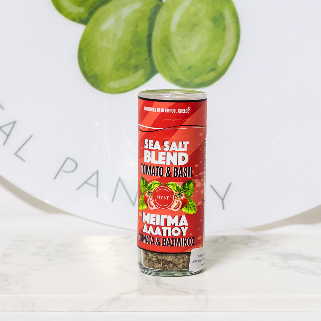 Sea salt blend canister with tomato and basil flavor on a white surface